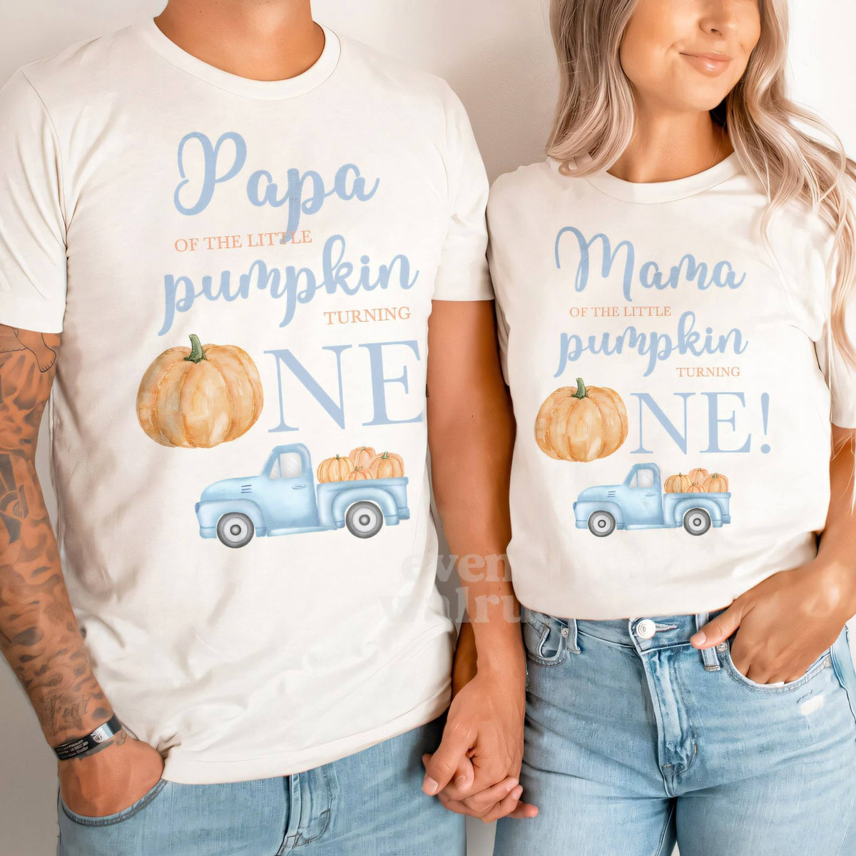 Dad and Mom holding hands in white Papa and Mama Little Pumpkin shirts.