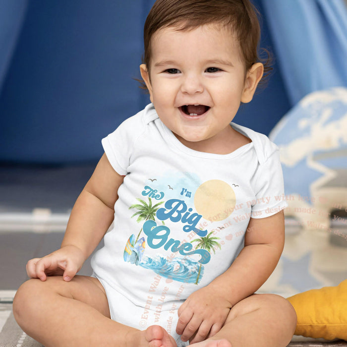 Smiling baby boy in a white I'm The Big One palm tree bodysuit.