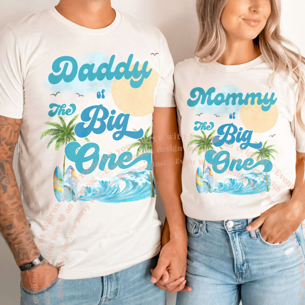 Couple in white Daddy and Mommy of The Big One palm tree shirts.