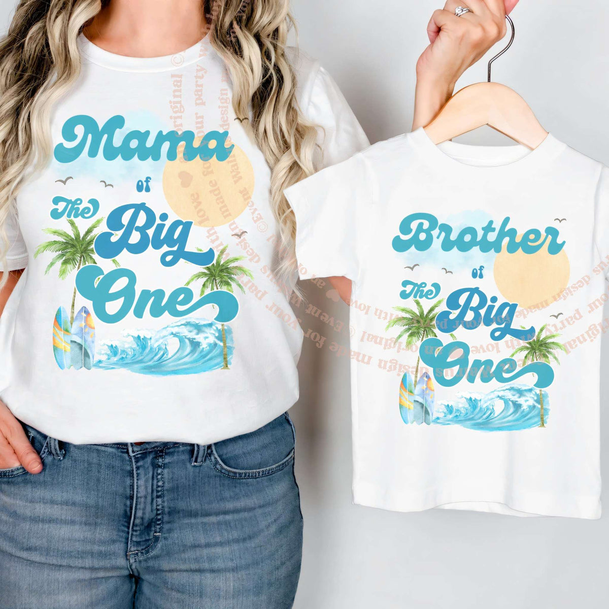 White Brother of The Big One shirt on a hanger beside a Mama tee.