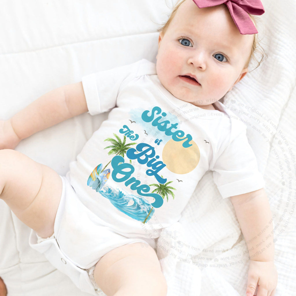 Baby girl with a pink bow in a white Sister of The Big One bodysuit.
