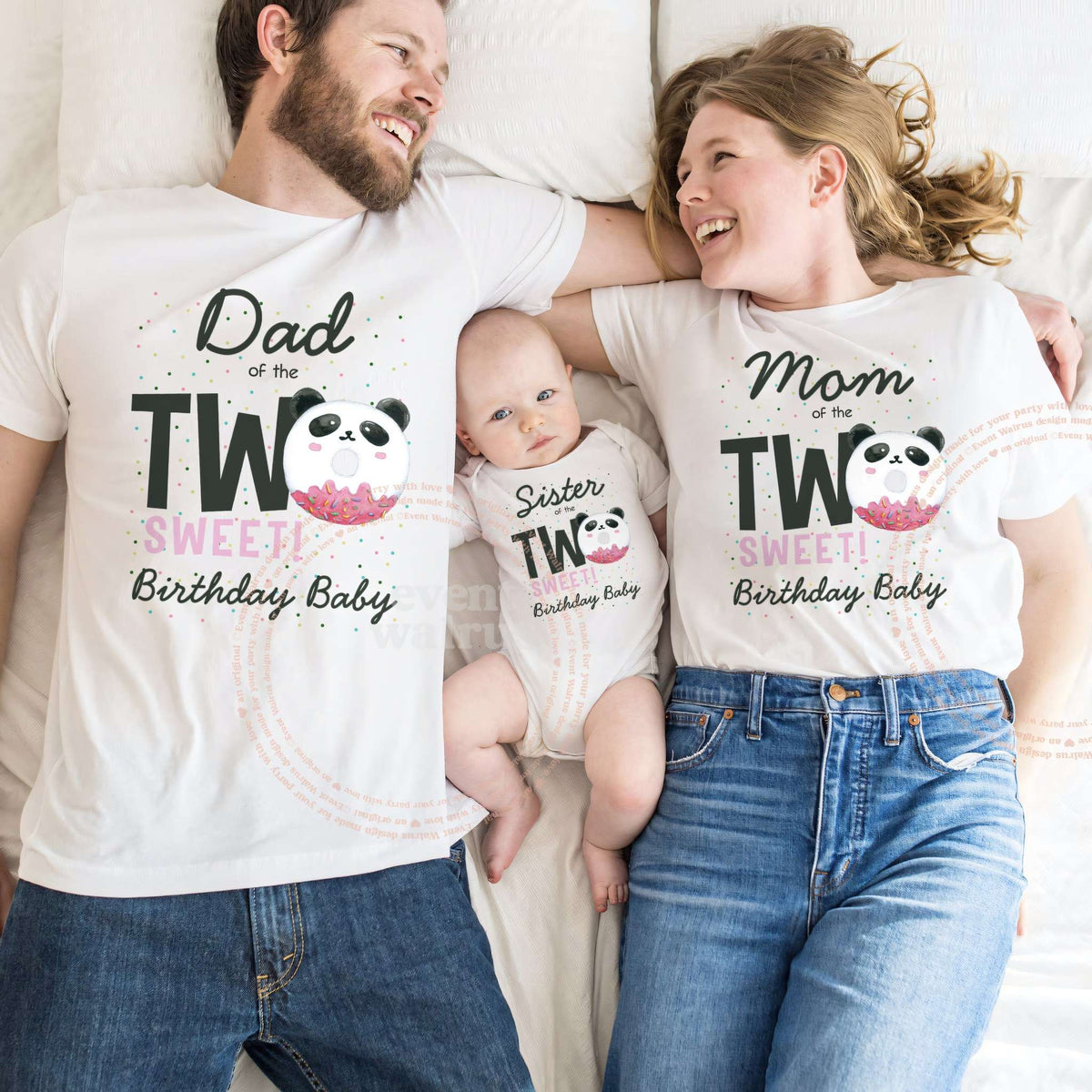 Dad and Mom lying beside their baby, all in white panda Two Sweet shirts.