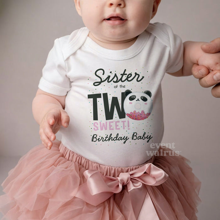 Baby in a pink tutu and a white Sister of the Two Sweet panda bodysuit.