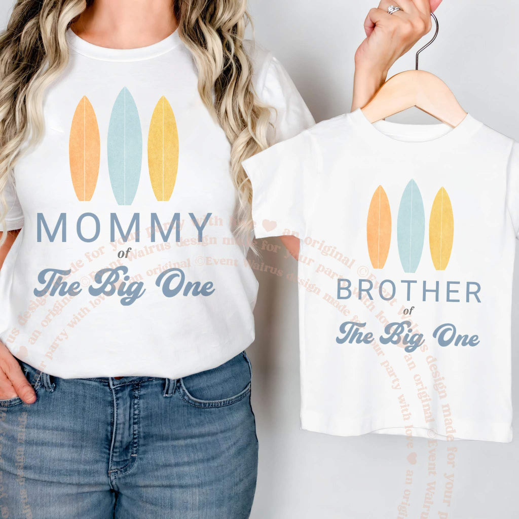White Brother of The Big One shirt on a hanger beside a Mommy tee.