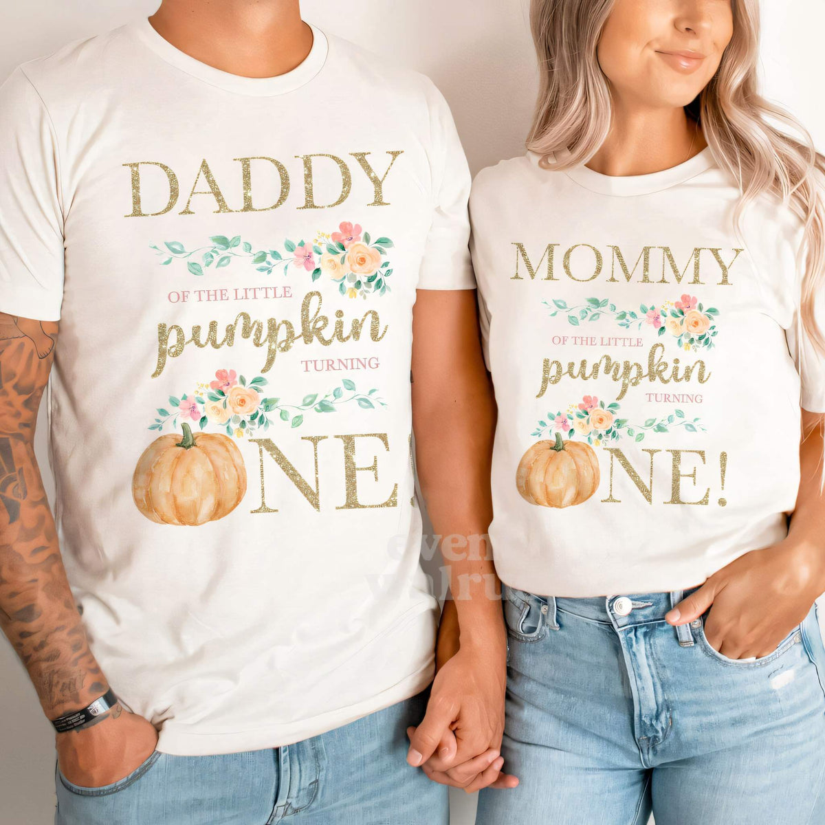Dad and Mom holding hands in white Daddy and Mommy floral Little Pumpkin shirts.
