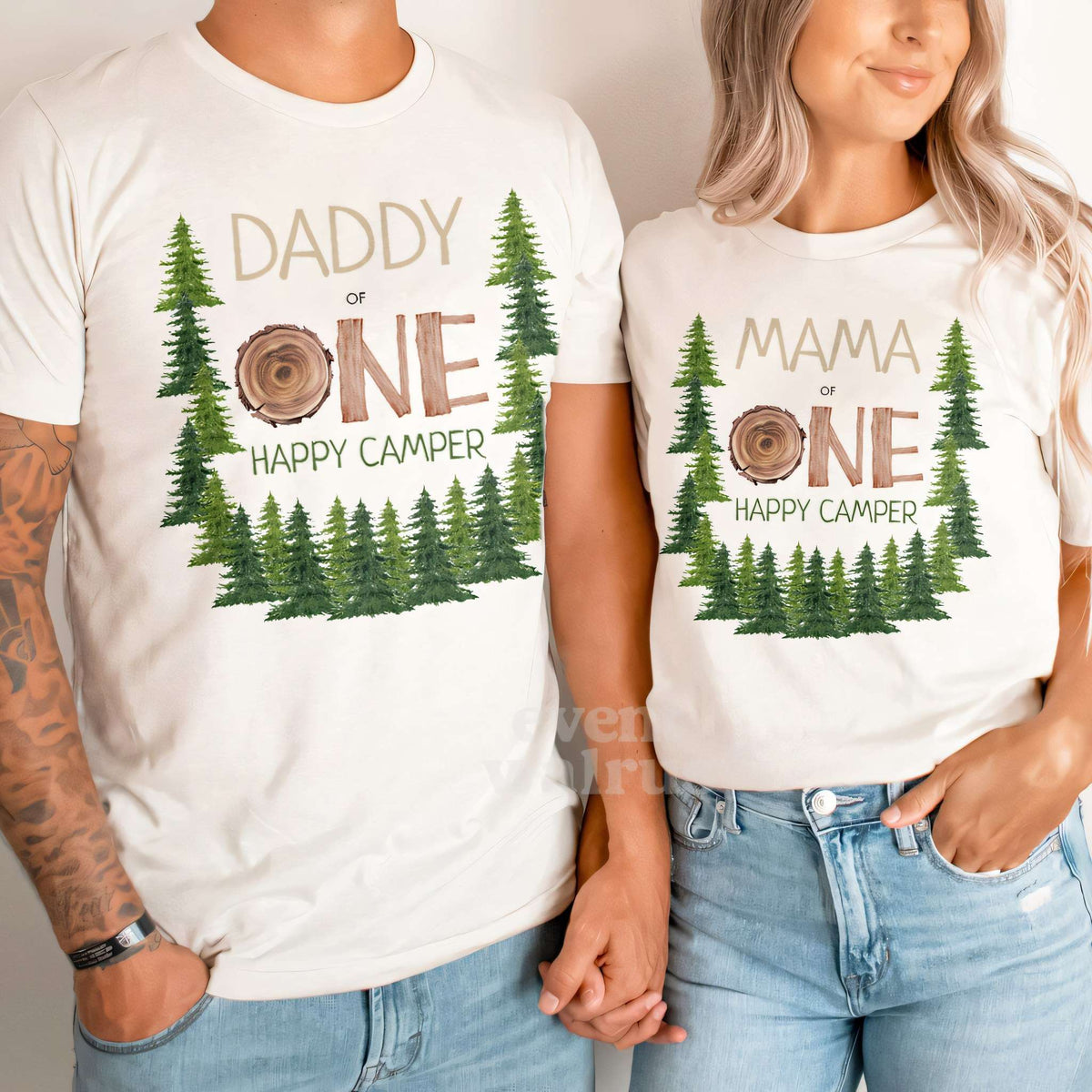 Dad and Mom holding hands in white Daddy and Mama wood slice One Happy Camper shirts.