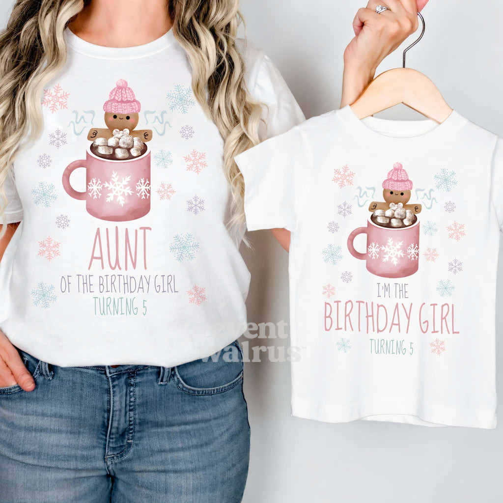 Aunt holding up a Birthday Girl Turning 5 tee on a hanger while wearing her Aunt shirt.