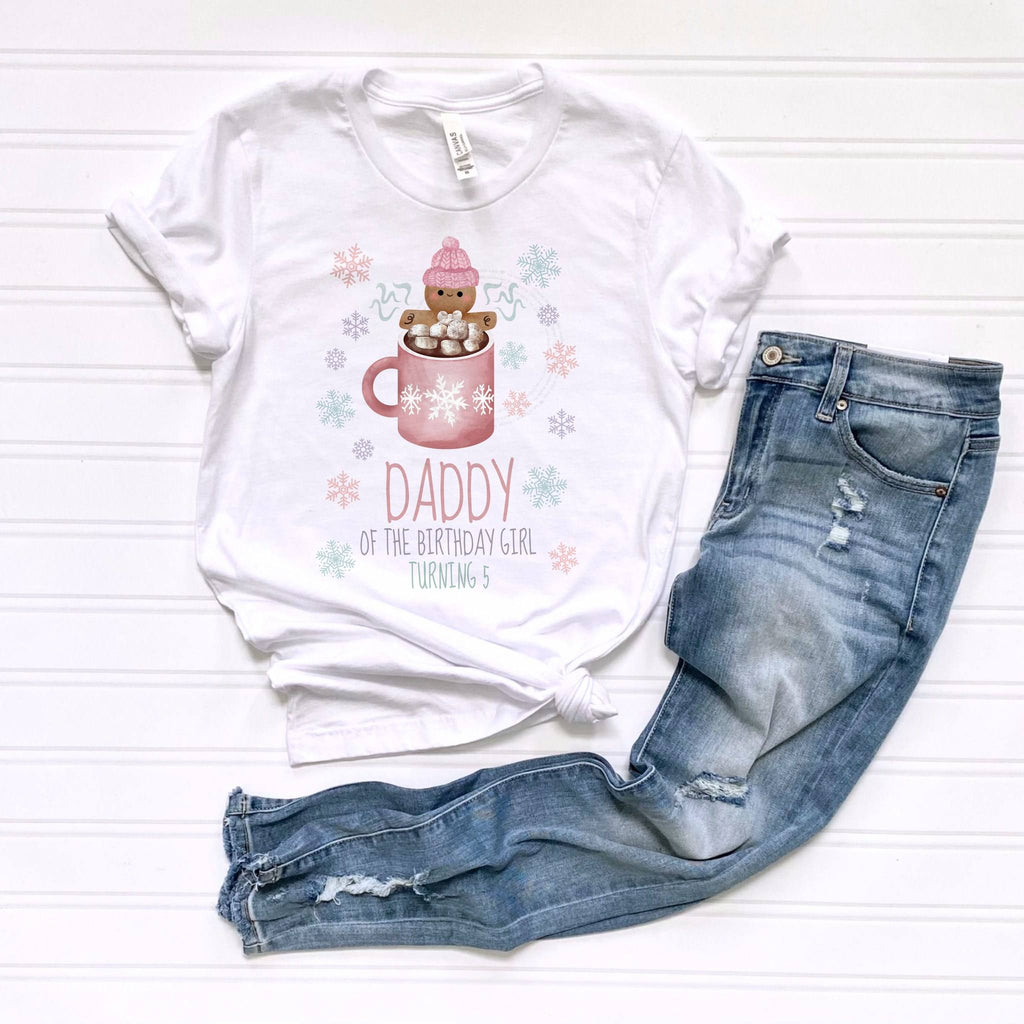 White Daddy of the Birthday Girl Turning 5 tee laid flat beside jeans.