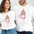Mom and Dad smiling in white Mama and Dad Cookies and Cocoa 5th birthday shirts.