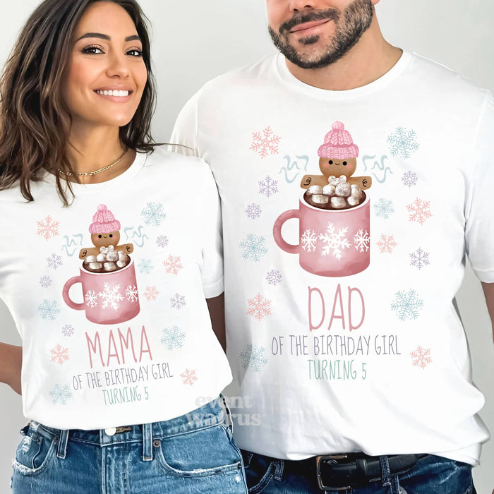 Mom and Dad smiling in white Mama and Dad Cookies and Cocoa 5th birthday shirts.