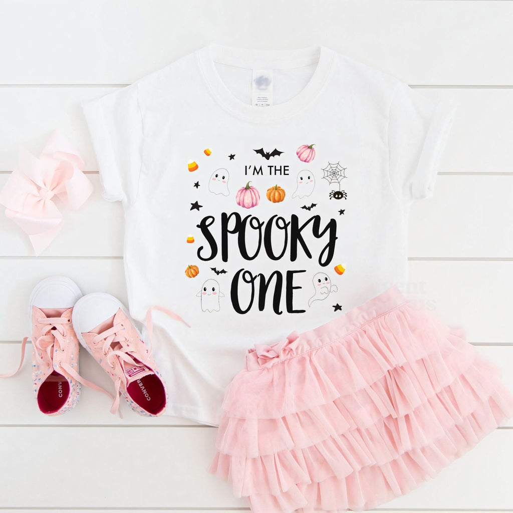 White I'm the Spooky One toddler tee laid flat with a pink tutu and sneakers.