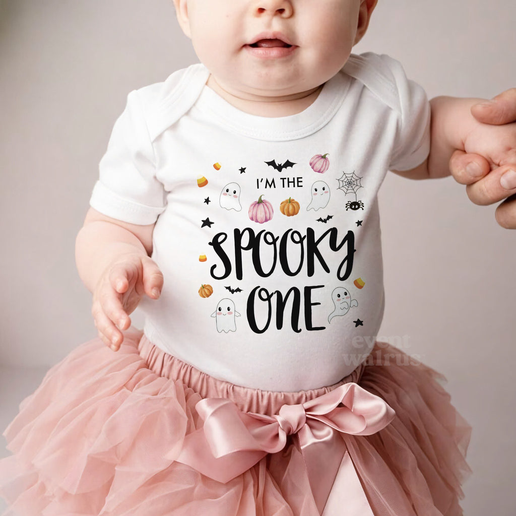 Baby girl in a pink tutu and a white I'm the Spooky One bodysuit.