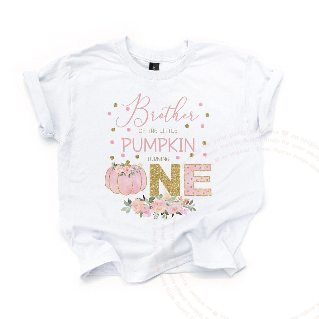 White Brother of the Little Pumpkin kids tee laid flat, with the pink pumpkin and gold glitter ONE.