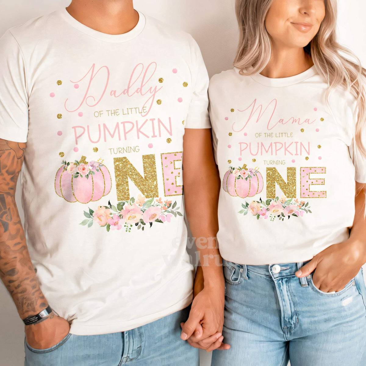 Dad and Mom holding hands in white Daddy and Mommy Little Pumpkin shirts.