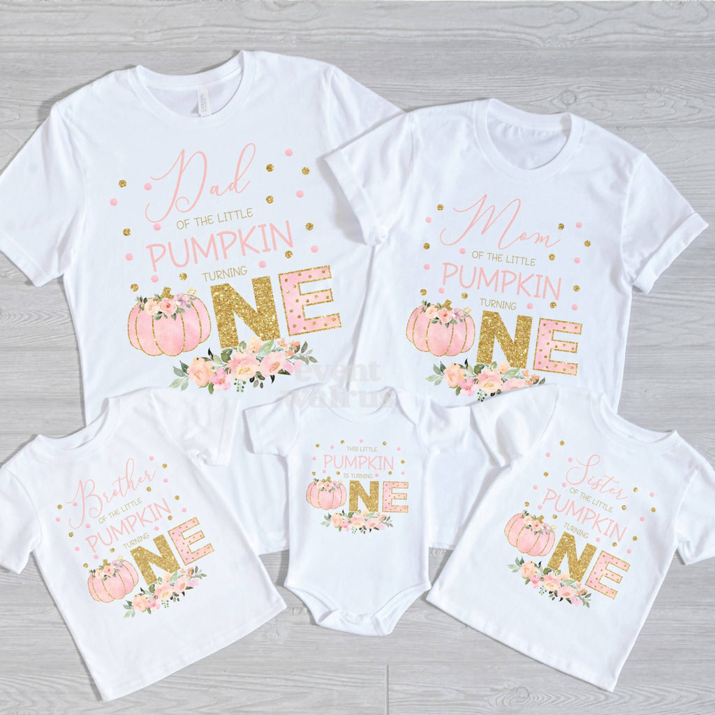 Dad, Mom, Brother, Sister and baby pink and gold Little Pumpkin shirts on gray wood.