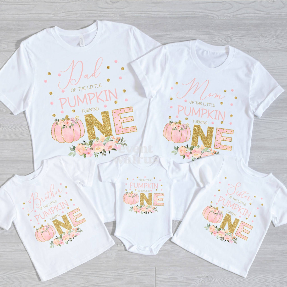 Dad, Mom, Brother, Sister and baby pink and gold Little Pumpkin shirts on gray wood.