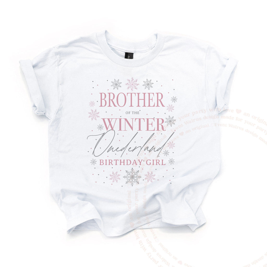 White Brother of the Winter Onederland kids tee laid flat, with pink lettering and silver snowflakes.
