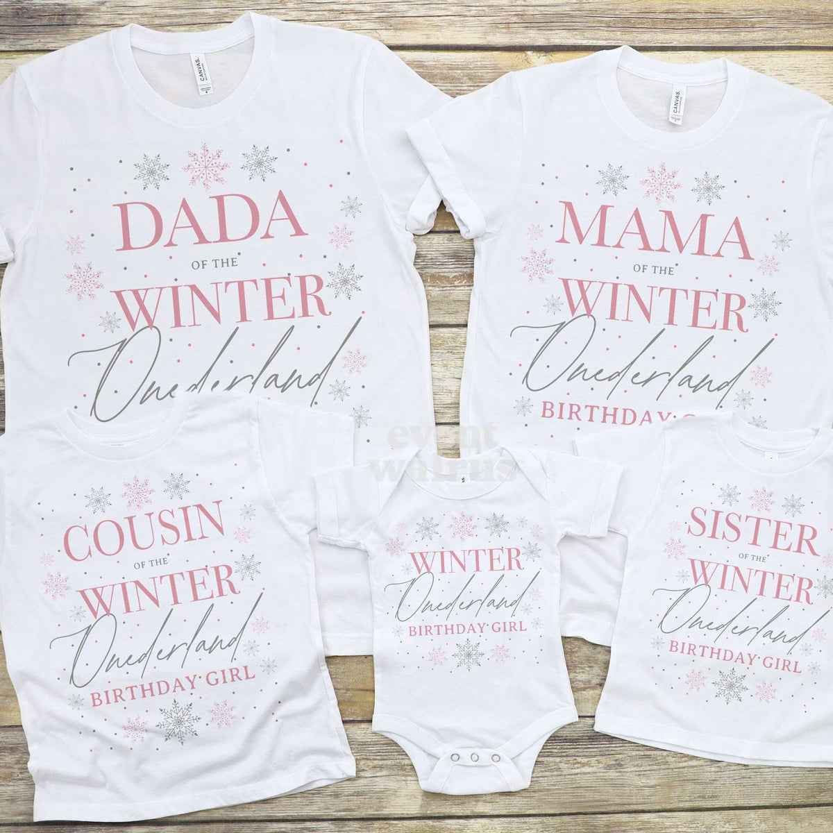 Cousin and Sister Winter Onederland tees laid out with Dada, Mama and the baby bodysuit.