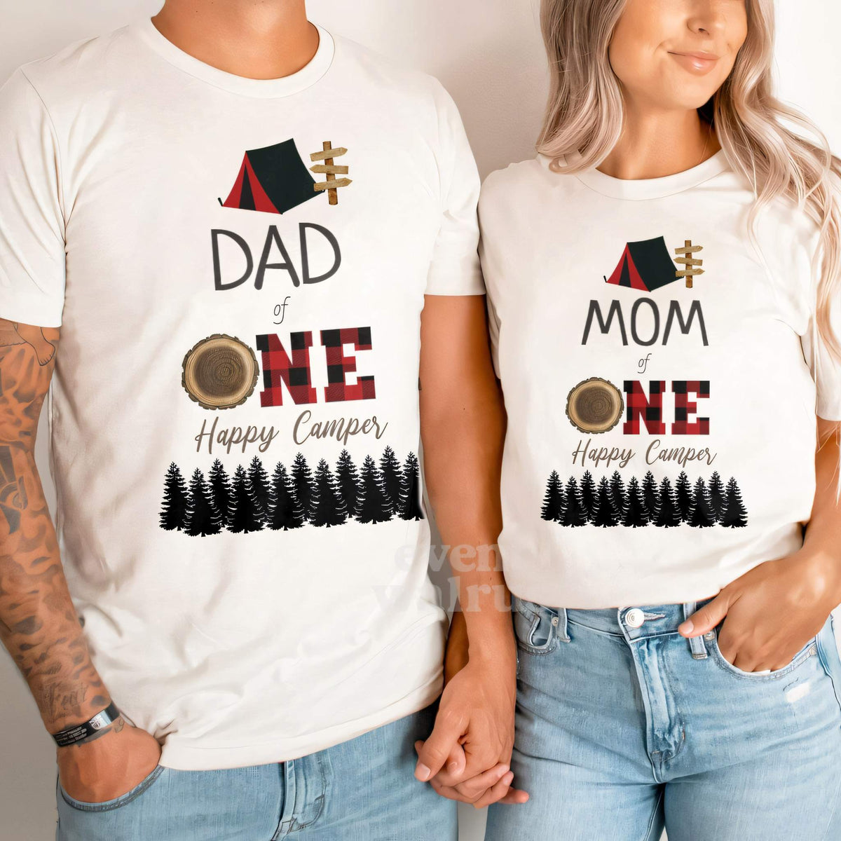 Dad and Mom holding hands in white Dad and Mom red plaid One Happy Camper shirts.
