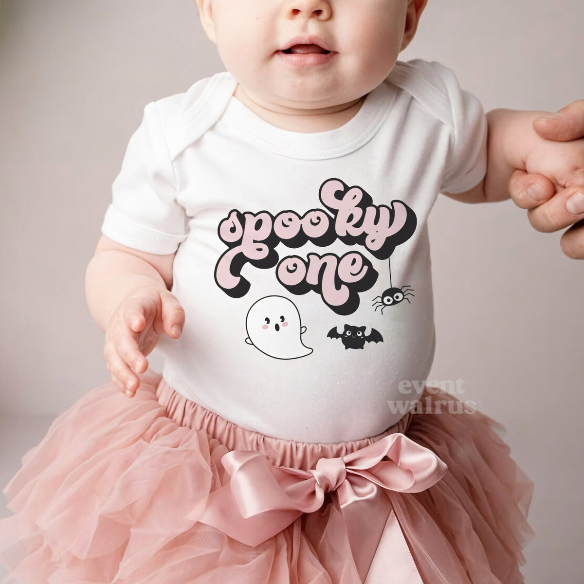 Baby girl in a pink tutu and a white Spooky One bodysuit.