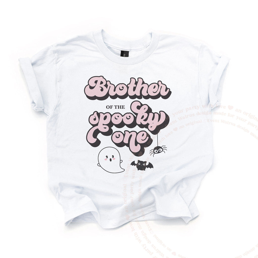 White Brother of the Spooky One kids tee laid flat, with a little ghost, bat and spider.