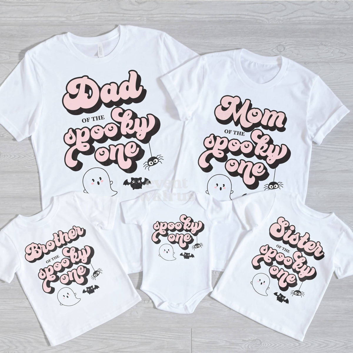 Dad, Mom, Brother, Sister and baby retro pink Spooky One shirts on gray wood.