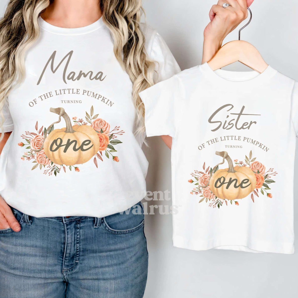 White Sister of the Little Pumpkin tee on a hanger, held up by Mom in her Mama shirt.