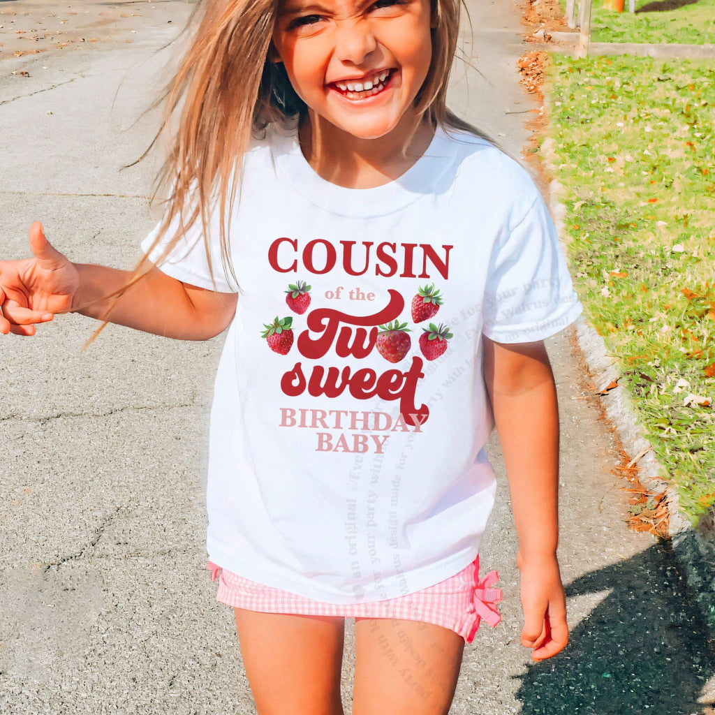 Laughing girl outdoors in a white Cousin of the Two Sweet kids tee.