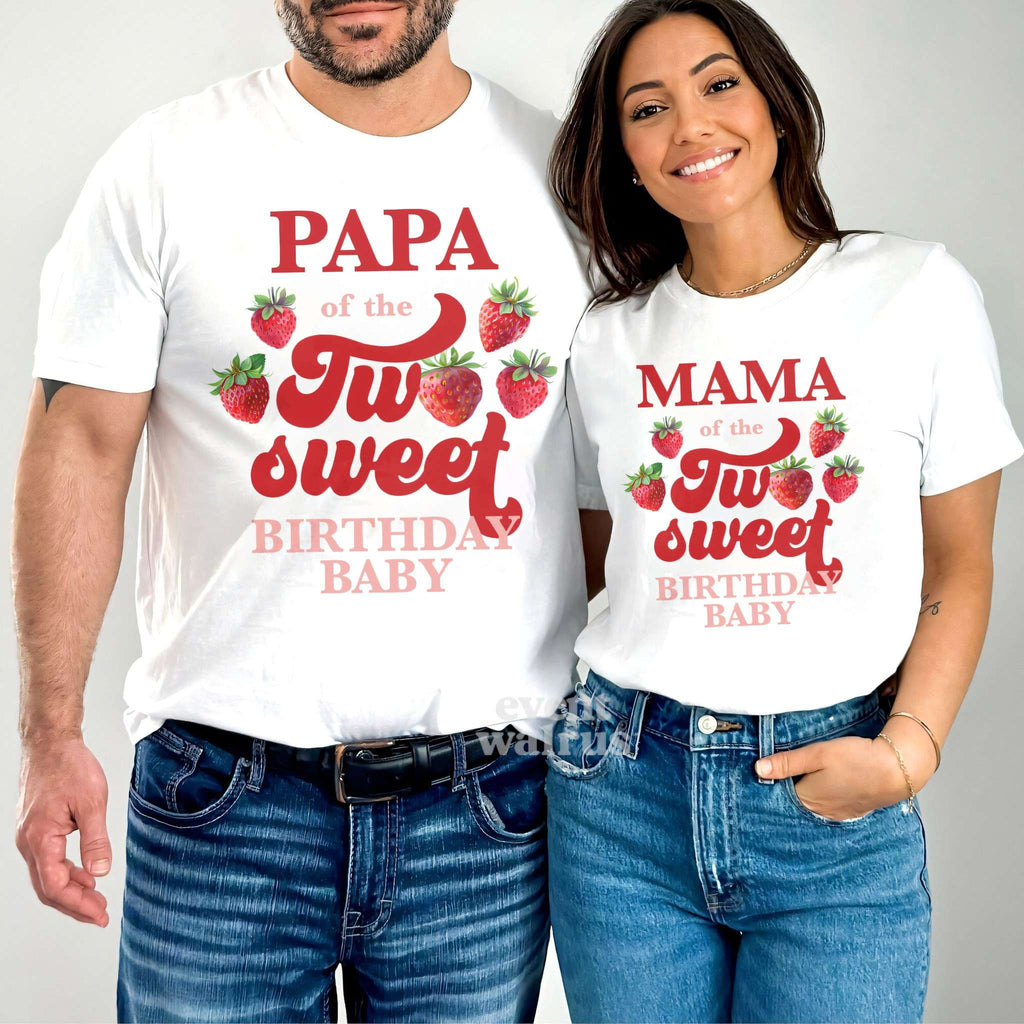 Dad and Mom standing together in white Papa and Mama strawberry Two Sweet shirts.