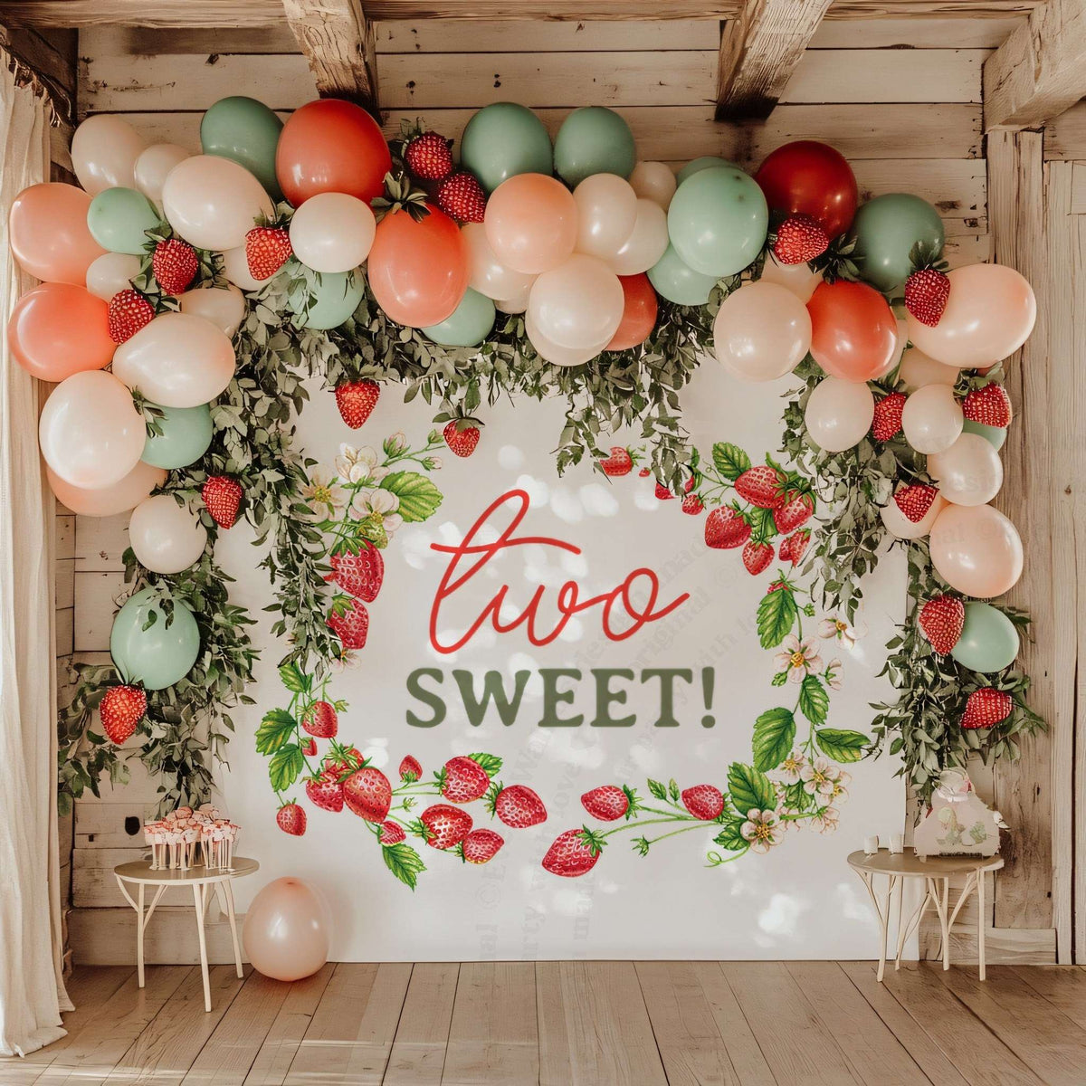 Strawberry two sweet backdrop under a wooden pergola with peach, coral and green balloons.