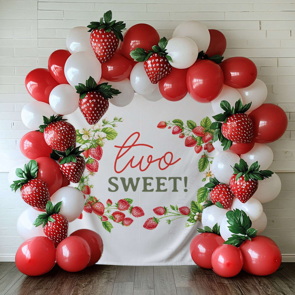 Two sweet strawberry vine backdrop framed by red and white balloons and strawberry balloons.