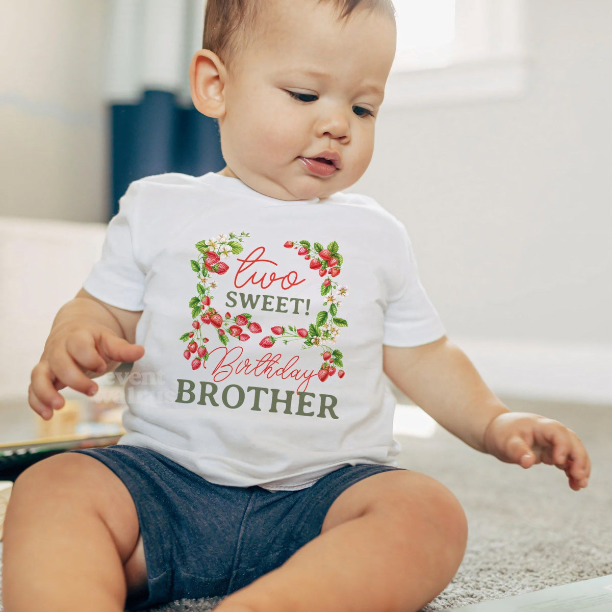 Baby boy sitting on a rug in a white Two Sweet Birthday Brother baby tee.