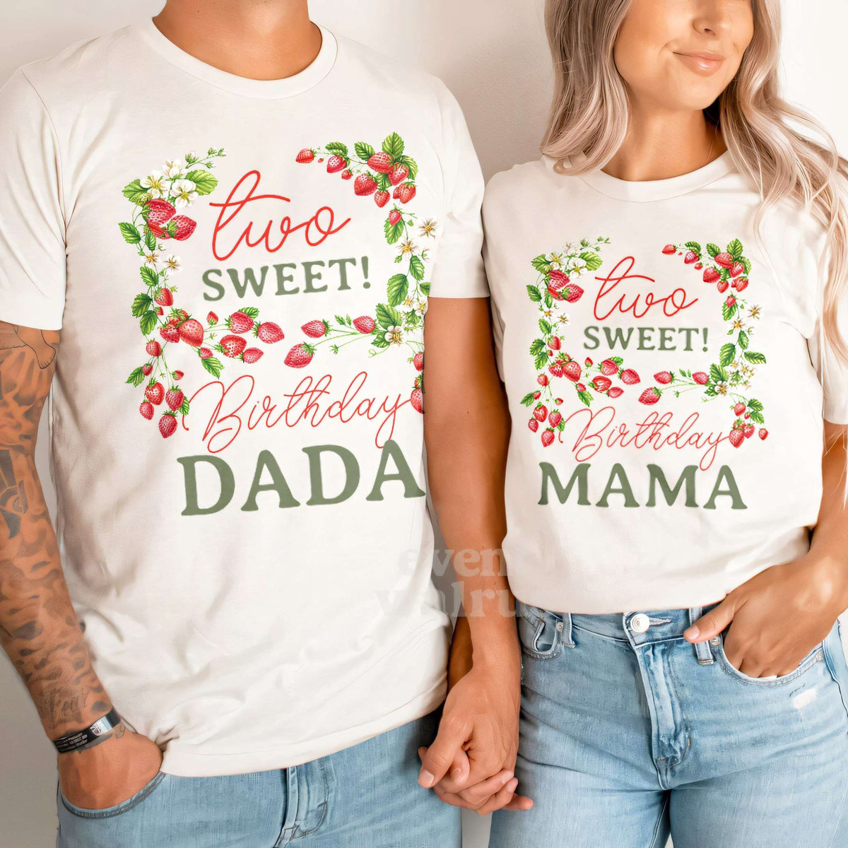 Dad and Mom holding hands in white Dada and Mama strawberry vine shirts.