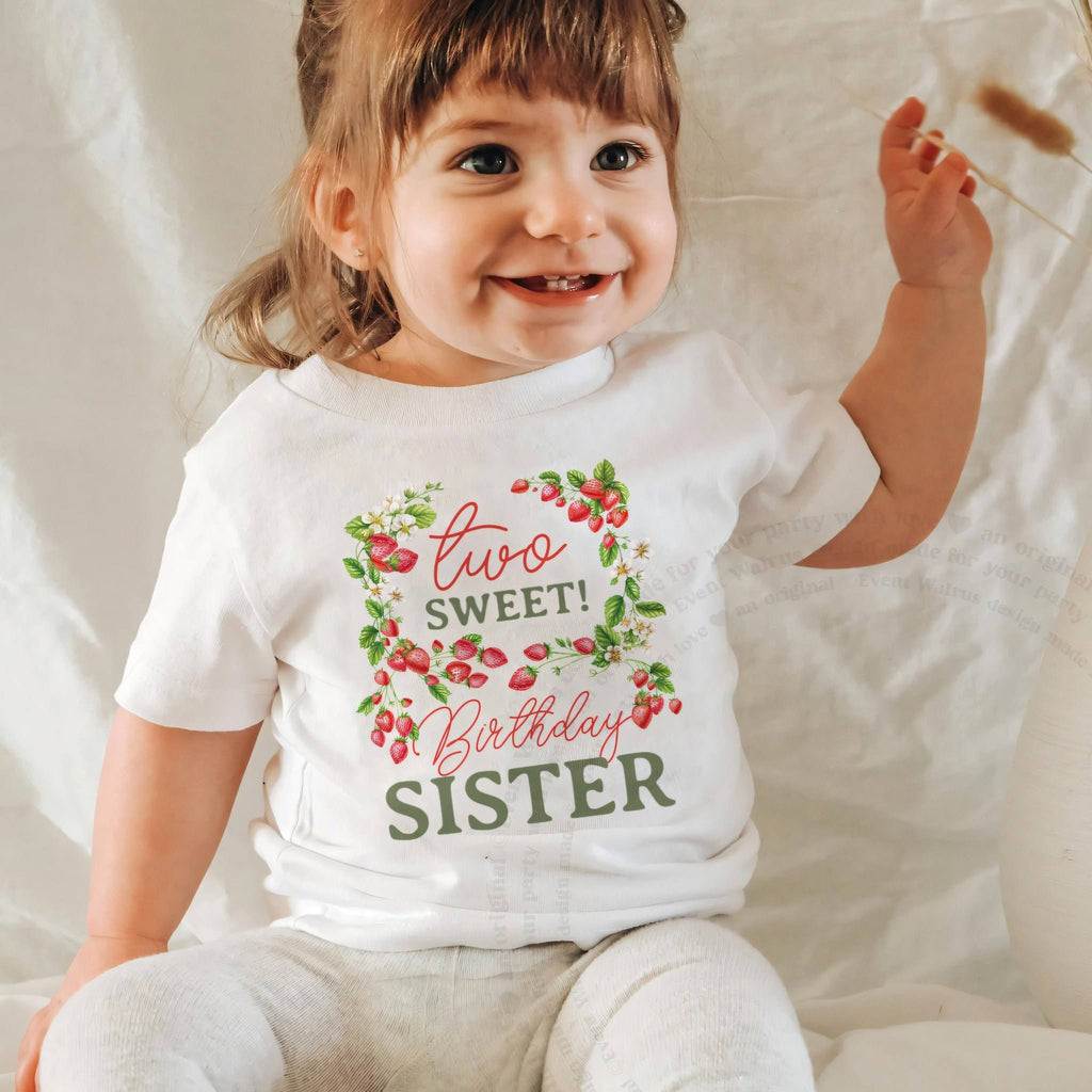 Laughing baby girl in a white Two Sweet Birthday Sister baby tee.