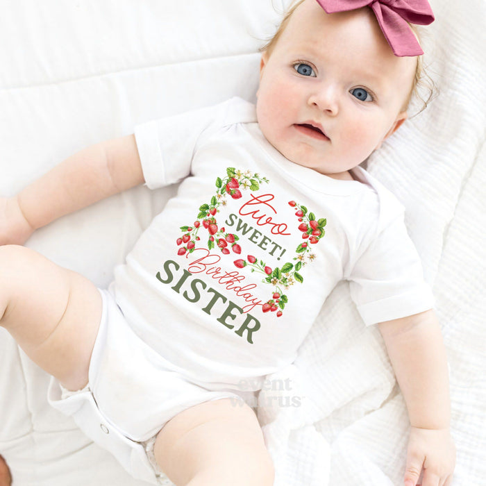 Baby girl with a pink bow lying in a white Two Sweet Birthday Sister bodysuit.