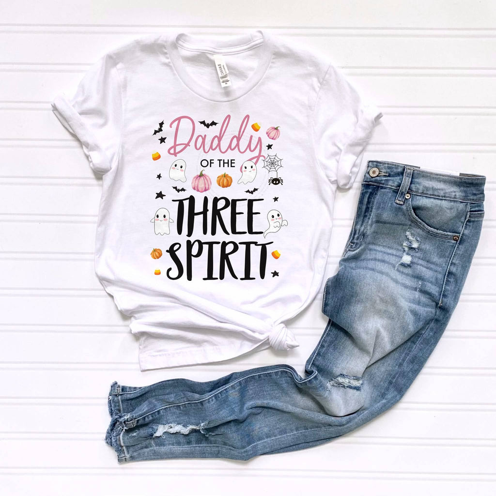 White Daddy of the Three Spirit tee laid flat beside jeans.