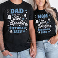 Dad and Mom in black Two Spooky Birthday Baby shirts with white ghosts and blue pumpkins.