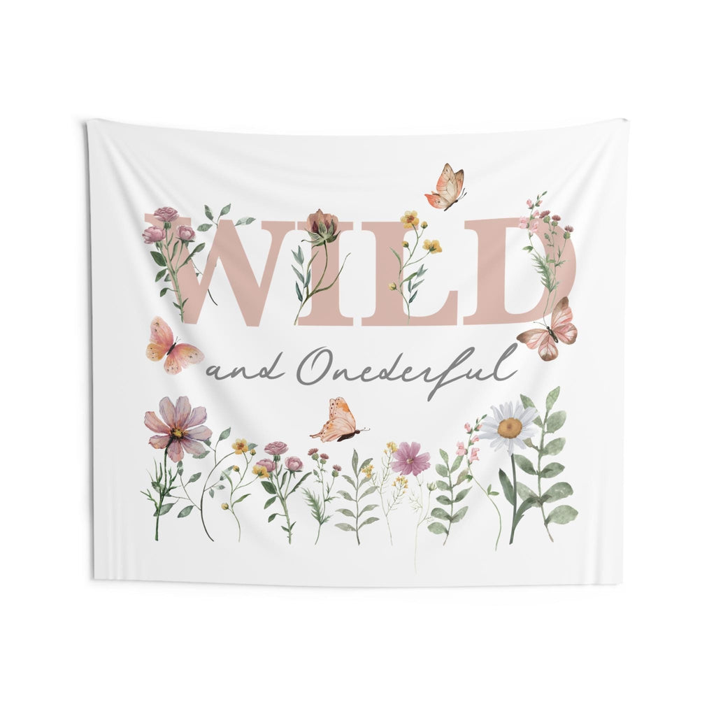 Wild and Onederful cake smash backdrop in a taller size, dusty pink letters over a meadow of wildflowers.