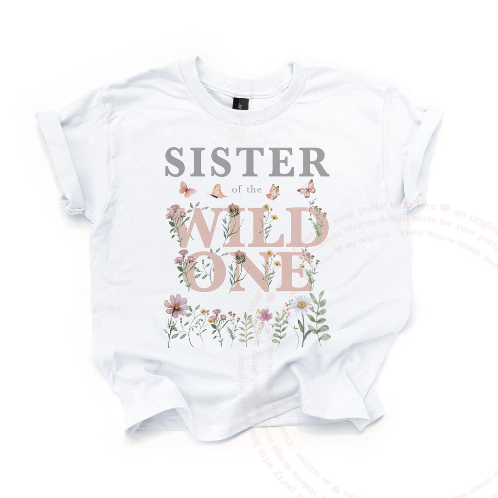 White Sister of the Wild One kids tee laid flat, with pink wildflower lettering and butterflies.