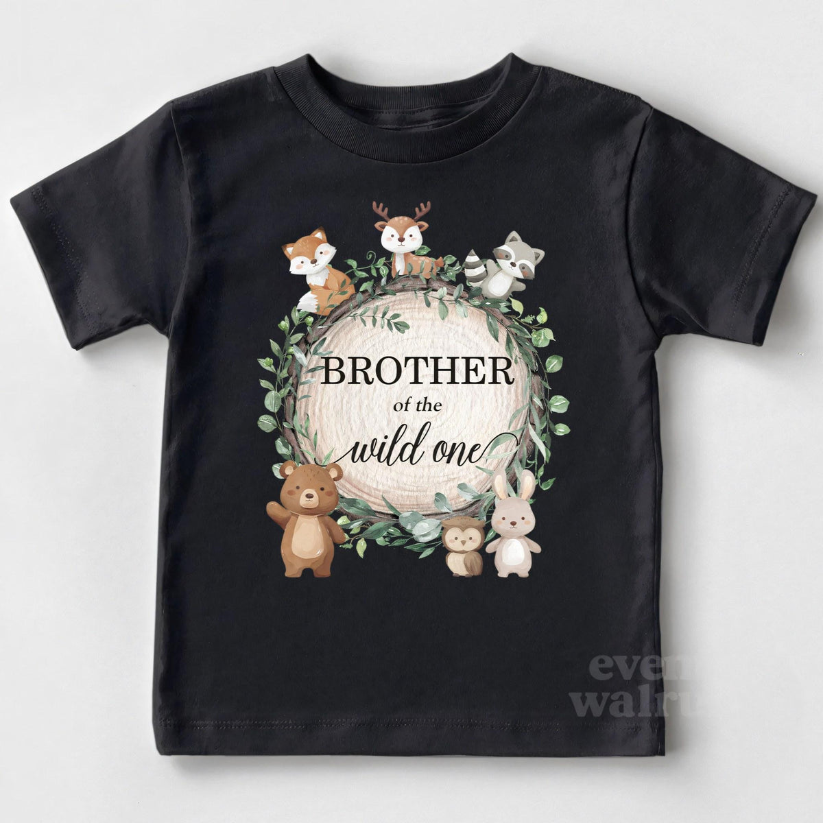 Black Brother of the Wild One toddler tee laid flat with the woodland wreath.